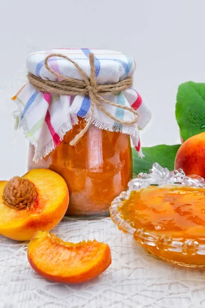 Peach jam in the jar on the table