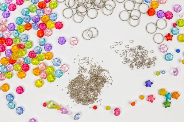 Set for design of colored beads on a white background, rings, beads, for example — Stock Photo, Image