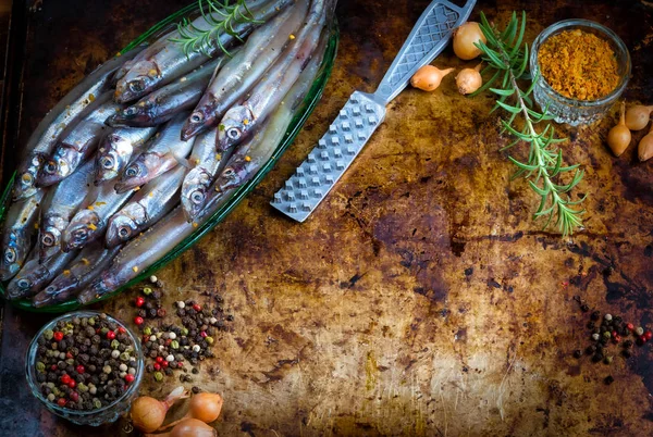 Fresh fish top view. Spicy herb and vegetables. Spice on wooden board. Healthy food cooking.