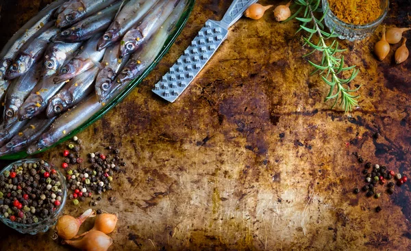 Fresh fish top view. Spicy herb and vegetables. Spice on wooden board. Healthy food cooking.