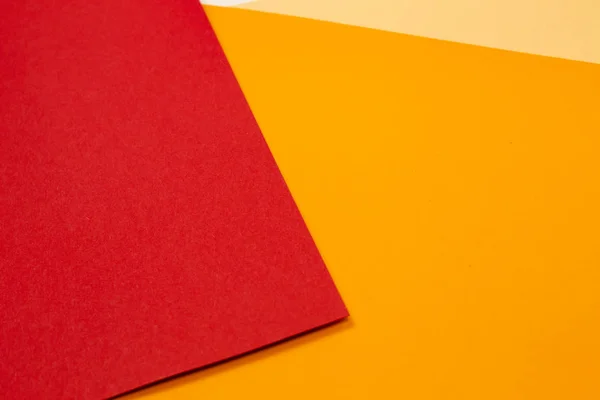 sheets of colored paper. Many colored sheets of paper are laid out in the harsh composition. background of colored paper. warm colors