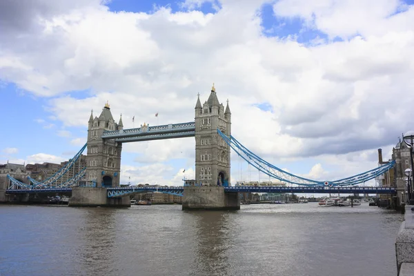 Tower Bridge in London UK. Tower Bridge is a combined bascule and suspension bridge in London built between 1886 and 1894. The bridge crosses the River Thames close to the Tower of London and has become an iconic symbol of London.