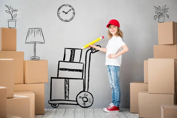 Happy child playing into new home — Stock Photo, Image
