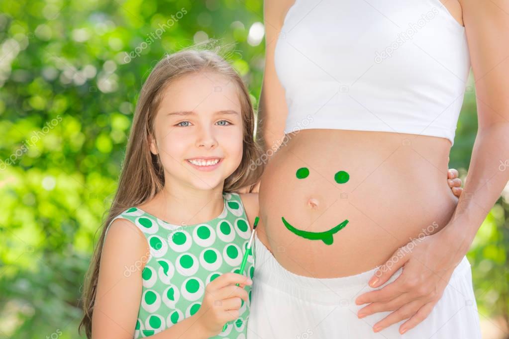 smile on belly of pregnant woman