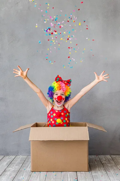 Funny kid clown playing indoor — Stock Photo, Image