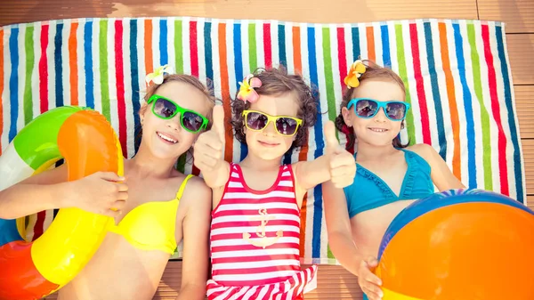 Happy children in swimming pool — Stock Photo, Image