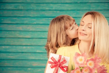 Woman and child with bouquet of flowers clipart