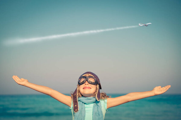 Family of superheroes on the beach. 