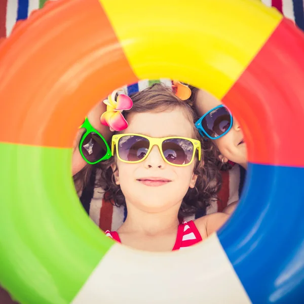 Happy children in the swimming pool — Stock Photo, Image