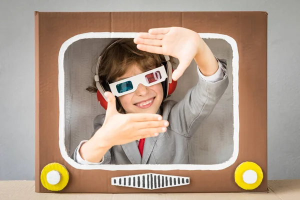 Child playing with cartoon TV — Stock Photo, Image