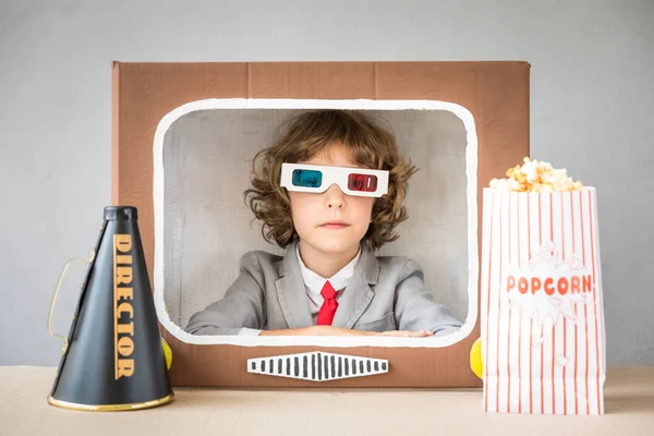 Child playing with boxTV — Stock Photo, Image