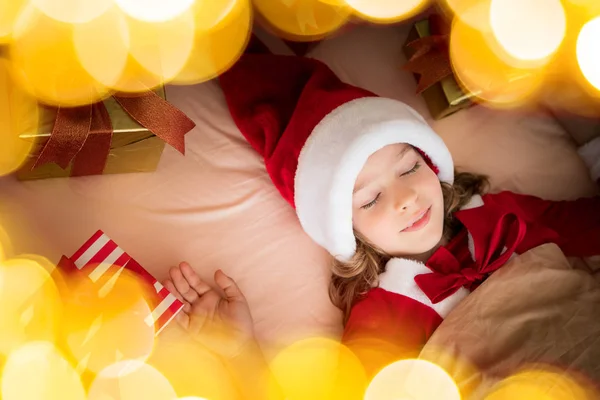 Girl sleeping near christmas presents — Stock Photo, Image