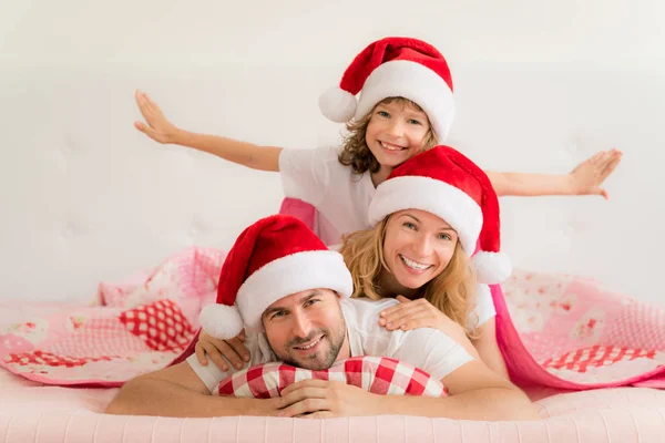 Family in Christmas Santa hats