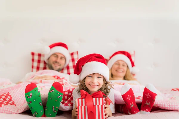 Family in Christmas Santa hats