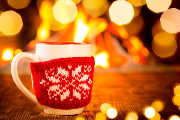 cup in knitted cover