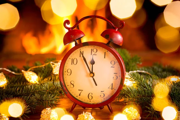 Alarm clock in center of christmas wreath — Stock Photo, Image