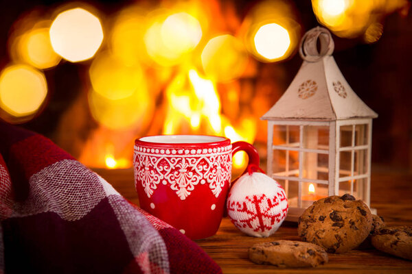 warm cocoa near fireplace