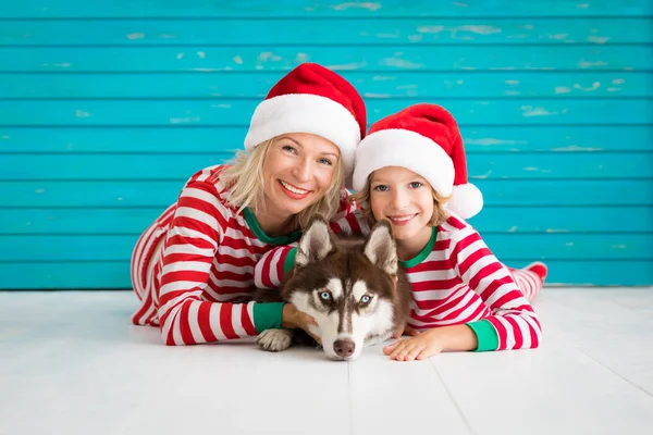 Happy child and dog on Christmas eve — Stock Photo, Image