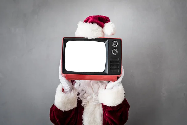 Père Noël tenant rétro TV — Photo