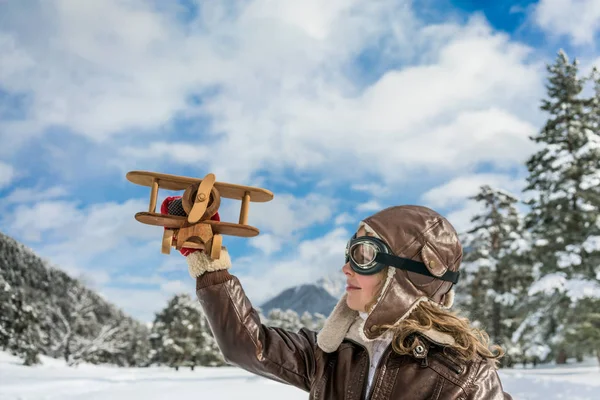 Happy child playing with toy airplane — Stock Photo, Image