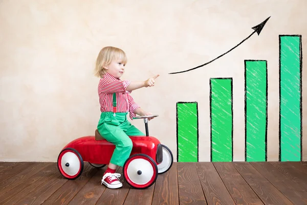 Happy child riding vintage car — Stock Photo, Image