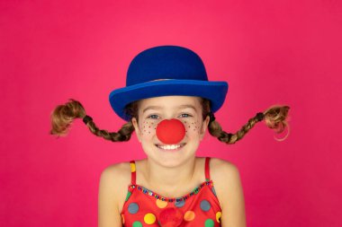 Funny girl clown playing indoor