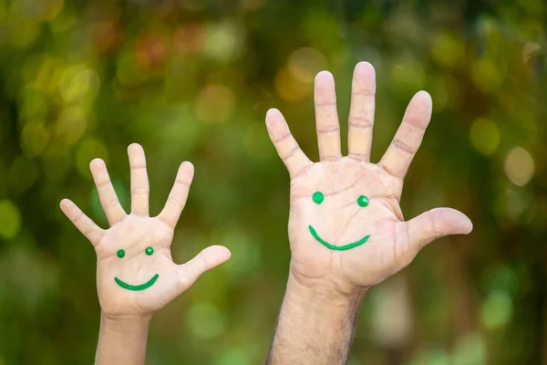 Painted Smiley Face Palms Spring Green Blurred Background Earth Day — Stock Photo, Image