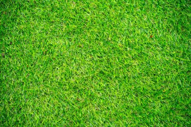 Arka plan ve doku, çimenlikte yeşil yapay çimen dokusu..