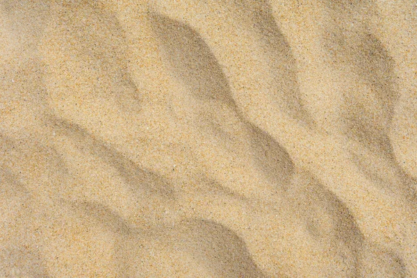 背景と質感 背景として夏の太陽の下でのビーチの砂のテクスチャの近くのUo — ストック写真