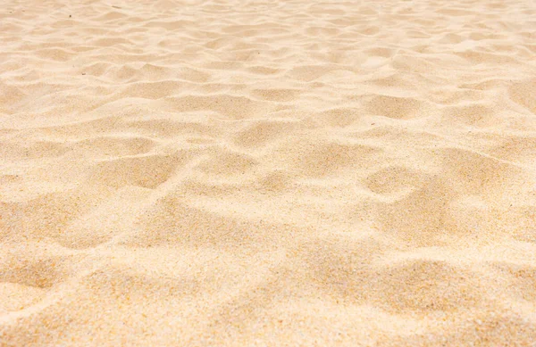 夏の太陽の下での上質な砂浜のテクスチャを背景に — ストック写真