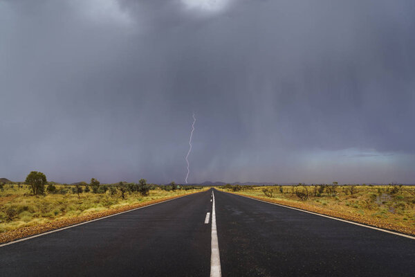 Highway in Australian outback during lightning storm - Marble Bar, Western Australia