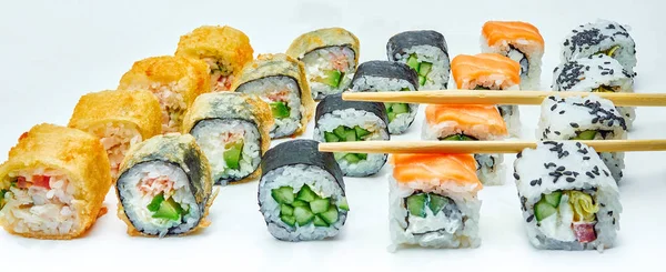 Set of tasty rolls on white background — Stock Photo, Image