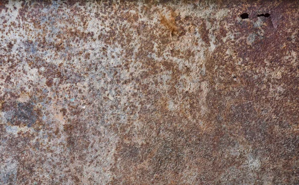 損傷を受けた錆びた鉄板金属の質感バックグラウンドホール — ストック写真