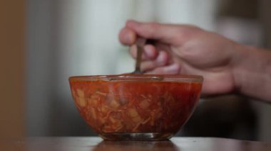 Man Eating Red Soup