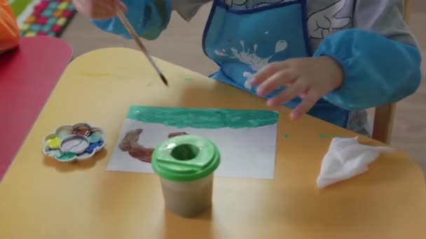 Little Boy Paints With Brush — Stok video