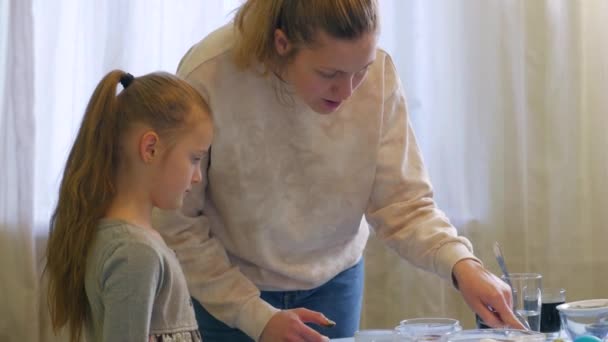 Mother And Daughter Paints Eggs — Stock Video