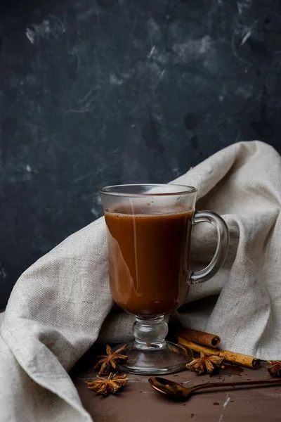 hot cocoa in a transparent mug with spices