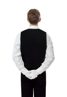 Rear view of young confident waiter clipart