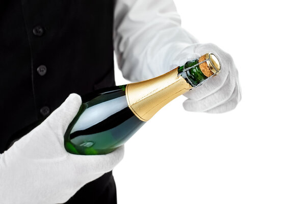 waiter opening bottle of champagne