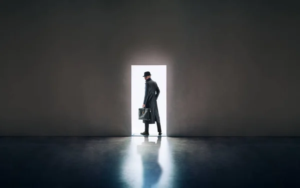 Man silhouette in hat and raincoat — Stock Photo, Image