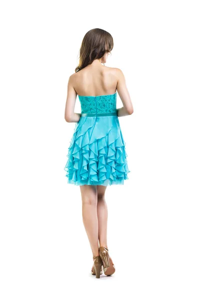 Вид ззаду на молоду красиву жінку в бірюзовій коктейльній сукні — стокове фото
