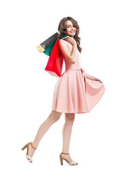 Happy beautiful woman holding many colorful shopping bags — Stock Photo, Image