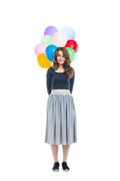 Beautiful young woman holding colorful balloons — Stock Photo, Image