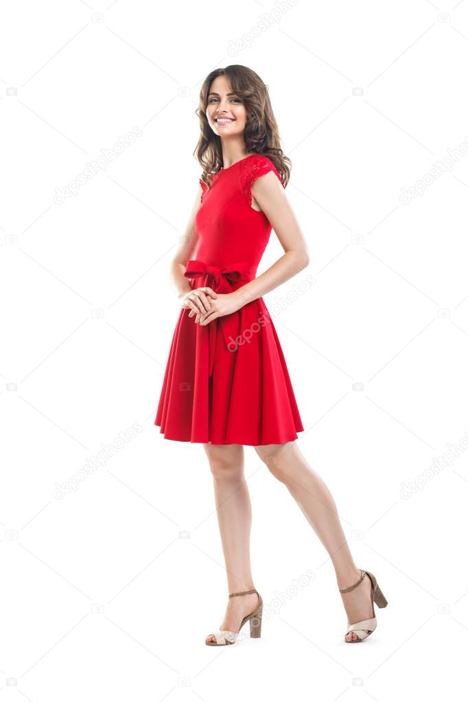 Happy beautiful woman in red dress isolated on white background