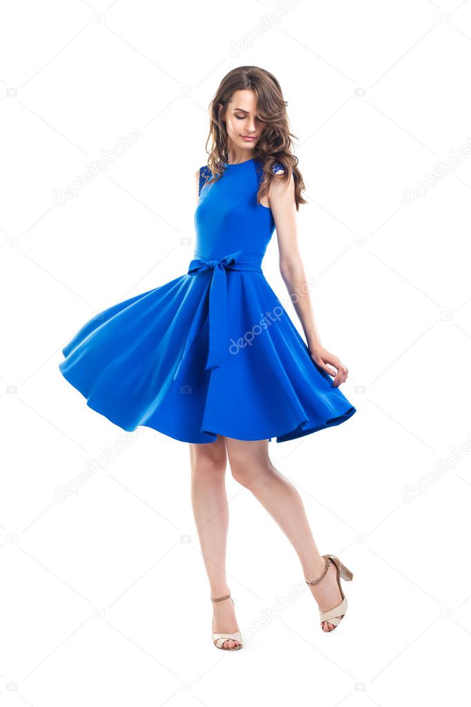 Happy beautiful woman in blue dress 
