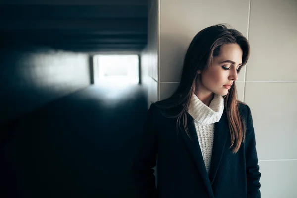 Beautiful lonely woman in a subway tunnel — Stock Photo, Image