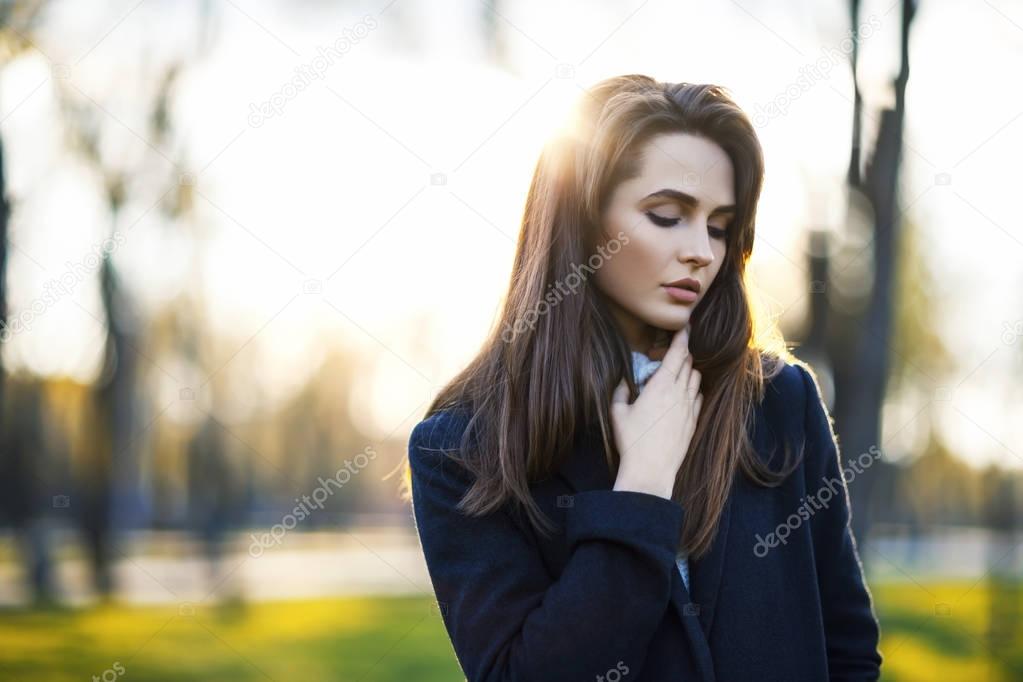 Beautiful woman in city park