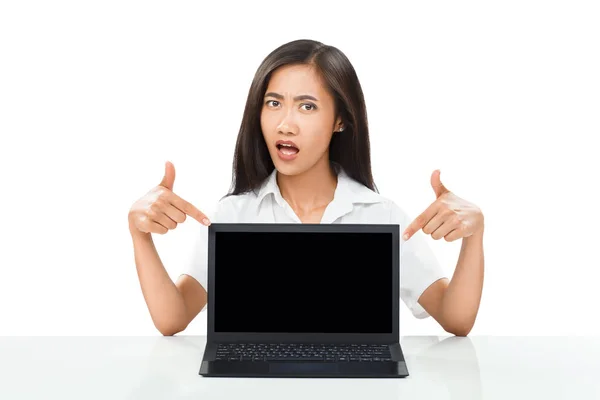 Woman pointing fingers at laptop — Stock Photo, Image