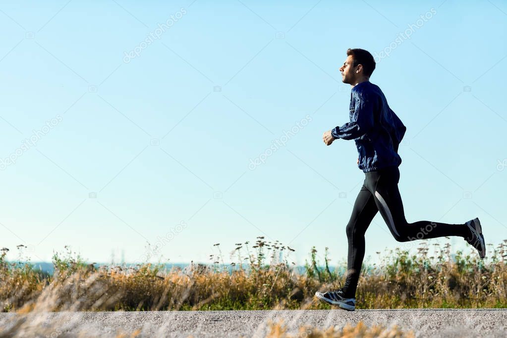 young man running on road