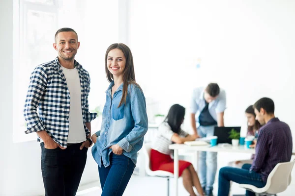 Businessman and businesswoman in office — Stock Photo, Image